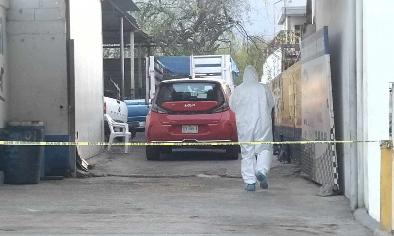 Ataque armado en taller mecánico deja un muerto y un herido